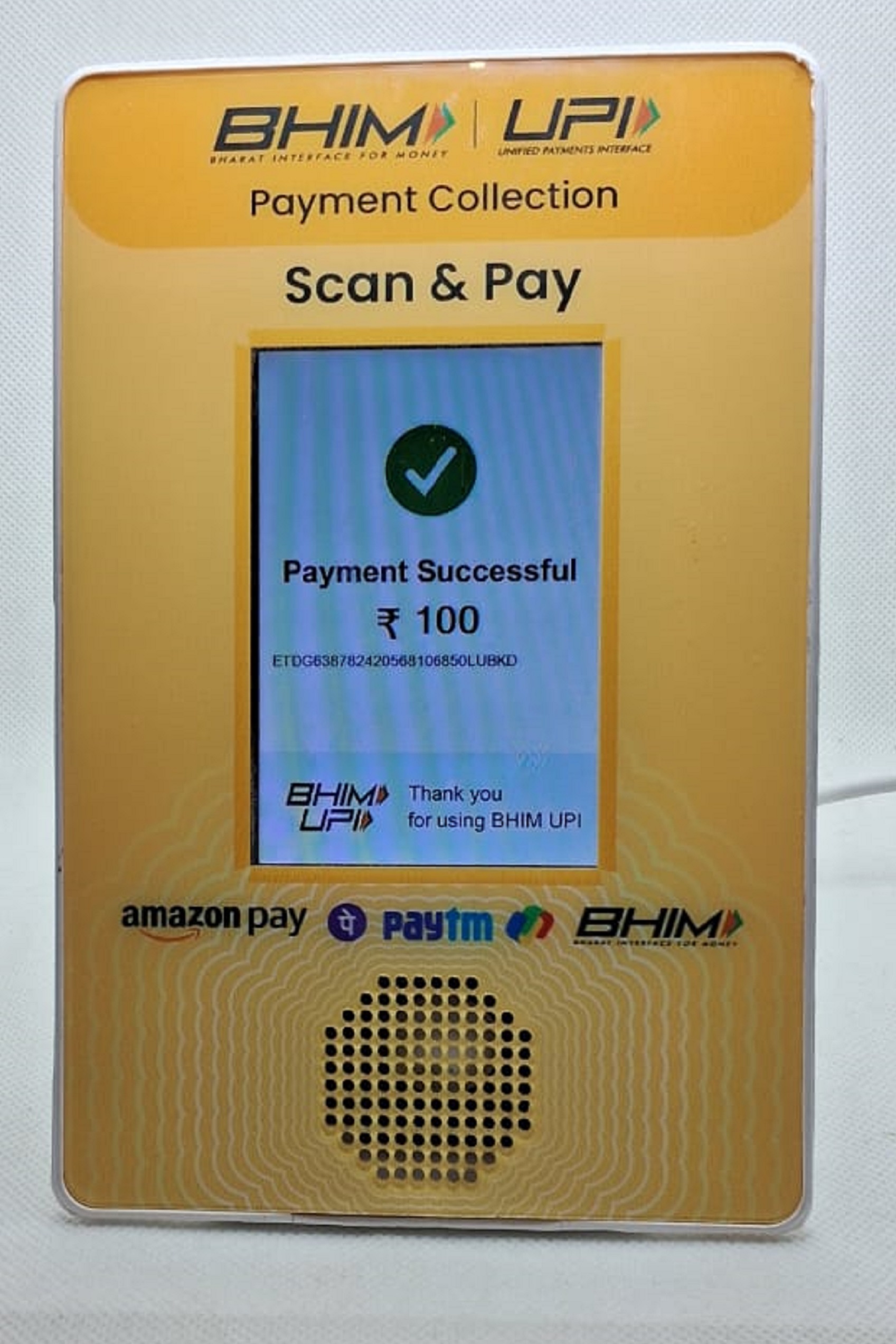 Store soundbox displaying promotional offer with QR